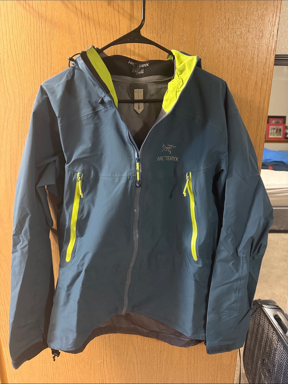 Arc'teryx Teal Jacket with Neon Yellow Accents